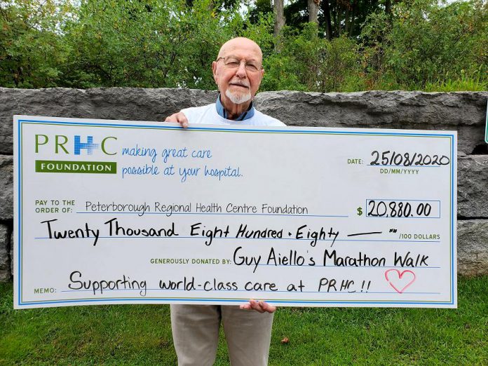 99-year-old Guy Aiello with a $20,880 cheque for Peterborough Regional Health Centre (PRHC) Foundation. Aiello, who celebrates his 100th birthday this fall, walked the equivalent of a marathon in July 2020 to raise funds for equipment and technology at the hospital. (Photo: PRHC Foundation / Facebook)