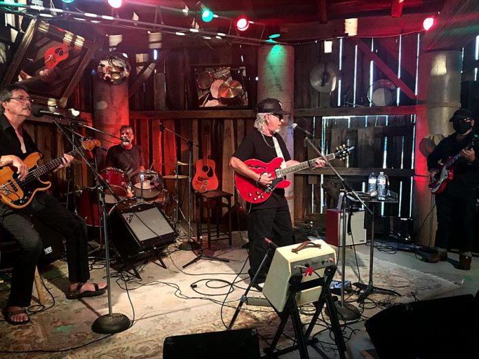 Local band Out On Bail (from left: Richard Simpkins, John Climenhage, Wylie Harold, and Wayne O'Connor) performs one of several numbers at Andy and Linda Tough's barn north of Norwood. The band is one of a number being featured as part of the "Live! At The Barn" series of shows recorded and presented by RMS Events and sponsored by Team vanRahan Century 21. Vidoes of the performances, along with inteviews with the musicians, will coming to YouTube starting August 21, 2020. (Photo: Paul Rellinger / kawarthaNOW.com)