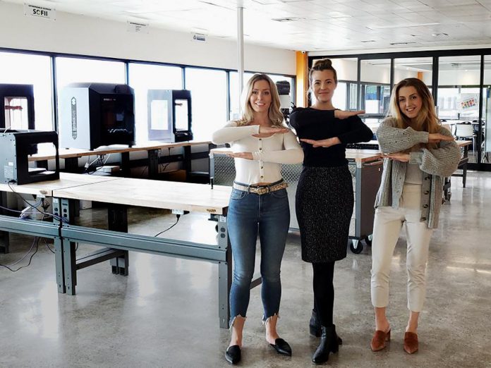 Members of the Chimp Treats team, including founder and CEO Brooke Hammer (right), demonstrating the "each for equal" symbol for International Women's Day 2020 at the Innovation Cluster's The Cube business incubator in downtown Peterborough. Chimp Treats is an innovative health food company that creates frozen dessert products made entirely from fruit. The Innovation Cluster's new "Women Breaking Barriers" program will support 20 women-led STEM and social innovation startups in Peterborough and the Kawarthas. (Photo courtesy of Innovation Cluster - Peterborough and the Kawarthas)