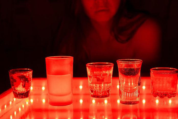 Alcoholic drinks being served in a strip club. (Stock photo)