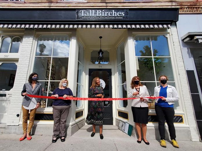 Tall Birches owner Autumn-Leeh Saunders (middle) at the official ribbon-cutting of her new Port Hope store. (Photo: Tall Birches / Facebook)