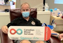 Chief Scott Gilbert of the Peterborough Police Service donating blood in July 2020. Canadian Blood Services in Peterborough has more than 400 open appointments in September and October. (Photo: Canadian Blood Services Peterborough / Twitter)