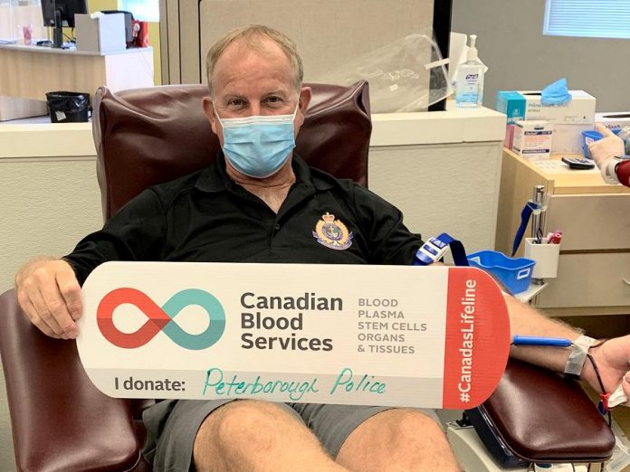 Chief Scott Gilbert of the Peterborough Police Service donating blood in July 2020. Canadian Blood Services in Peterborough has more than 400 open appointments in September and October. (Photo: Canadian Blood Services Peterborough / Twitter)