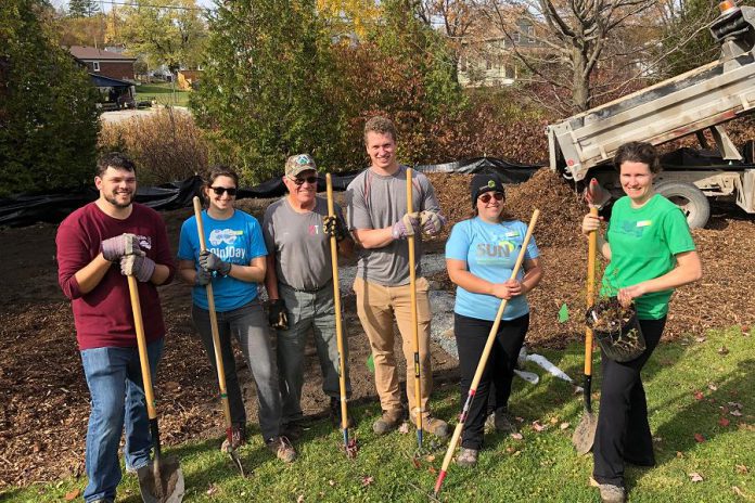 Unlike this 2019 planting of a 101-square-metre rain garden at the Warsaw municipal office on South Street, the September 25th planting will require participants to maintain two metres of physical distancing, sanitize tools, use a provided hand-washing station, and bring their own gardening gloves, tools, water, and food. (Photo: Jacob Rodenburg)