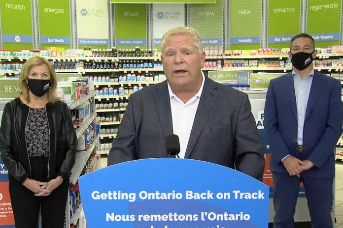 Ontario Premier Doug Ford, accompanied by health minister Christine Elliott and Shoppers Drug Mart president Jeff Leger, at a media conference on September 23, 2020 at Shoppers Drug Mart in Huntsville, where he announced COVID-19 tests for people without symptoms will be available at 60 pharmacies in Ontario. (CPAC screenshot)