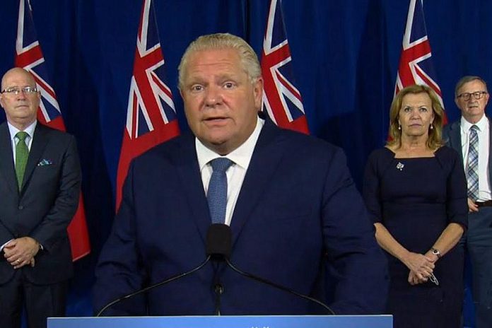 Ontario Premier Doug Ford announces new social gathering restrictions in Toronto, Ottawa, and Peel Region during a media conference at Queen's Park on September 17, 2020, along with municipal affairs and housing minister Steve Clark, health minister Christine Elliott, and chief medical officer of health Dr. David Williams. (CPAC screenshot)
