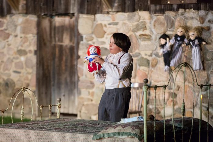 Lev Khaimovich as Samuel Deyell in 4th Line Theatre's "Bedtime Stories and Other Horrifying Tales". The outdoor production begins in the barnyard area of the Winslow Farm, where the audience is introduced to the Deyell family. The audience then follows the play's characters on an immersive promenade experience over around one kilometre of the property. (Photo: Wayne Eardley / Brookside Studio)