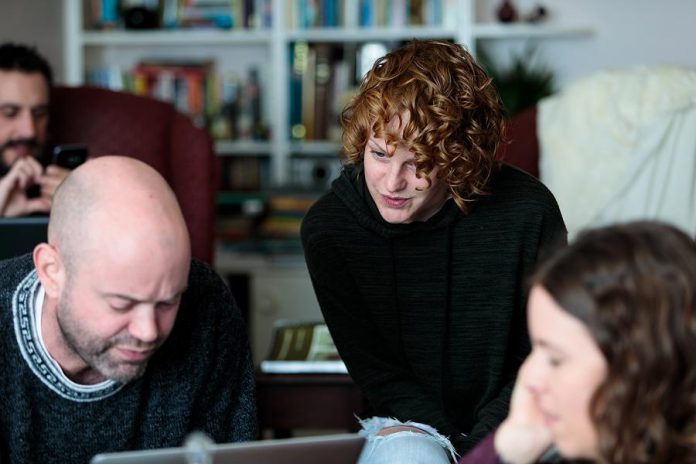 LLAADS members Luke Foster, Dan Smith, Sarah McNeilly, and  Lindsay Unterlander workshopping material. In two years, the troupe collectively wrote, memorized, blocked, designed, and performed 225 original scripts. (Photo: Adam Martignetti)