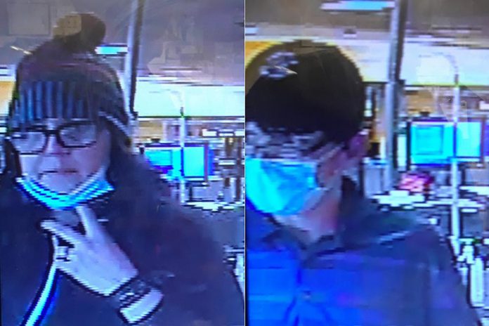 Police are looking to identify this woman and man, who are suspected of having stolen three bottles of liquor from the Norwood LCBO on October 6, 2020. (Police-supplied photos)