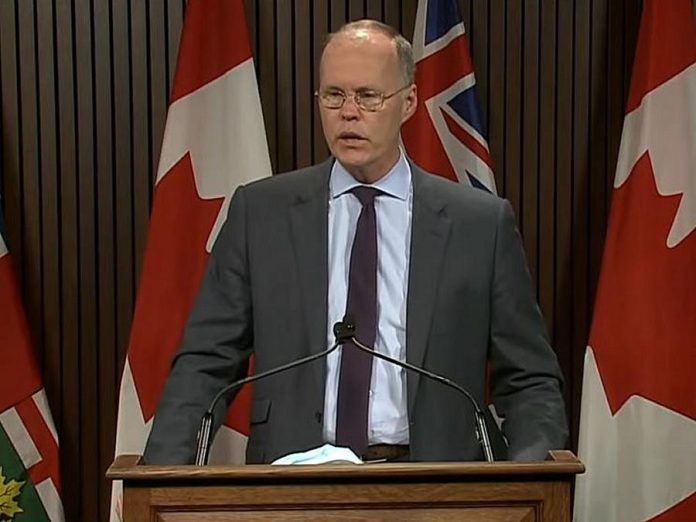 Adalsteinn Brown, dean of the Dalla Lana School of Public Health at the University of Toronto, discusses updated COVID-19 modelling projections at a media conference at Queen's Park on November 12, 2020. If current restrictions are not changed, Ontario is on track to see up to 7,000 new daily COVID-19 cases by the end of December. (Ontario Parliament screenshot)