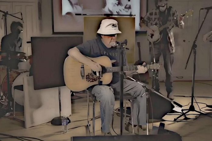 Omemee's Bob Young performing his song "Hey America" along with Peterborough musicians Ryan Weber of The Weber Brothers and Melissa Payne and Travis Good and Mike Belitsky of Toronto band The Sadies. Bob's younger brother, the legendary Neil Young, also performs in the video. (Screenshot)