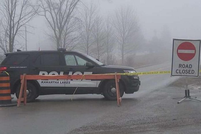 A Kawartha Lakes police vehicle blocks access to Pigeon Lake Road east of Lindsay after a police shooting on November 26, 2020 that resulting in a 33-year-old suspect and an OPP officer being seriously injured. The suspect's one-year-old son was found fatally shot in the man's pickup truck. (Photo: CBC)