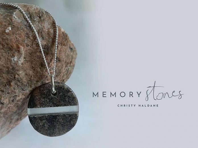 Christy Haldane also creates custom "Memory Stones" that, like her vases and pendants, fuse glass with stone -- but you provide her with stones you have collected that have special meaning for you.  Memory Stones are available as pendants, lone sculptures, and memorial sculptures.  (Photo courtesy of Christy Haldane)