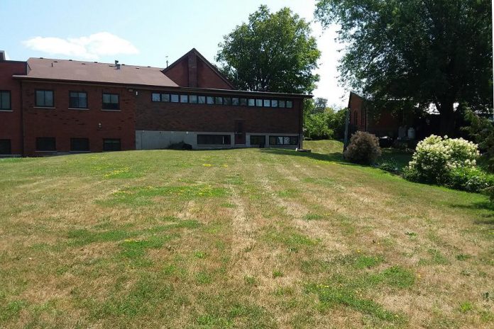 To dispose of and treat their wastewater, rural property owners rely on septic systems, like the one under the lawn here at the Township of Douro-Dummer municipal office. If you are installing a new septic system, check first with your township office for siting, testing, and maintenance information, and consult the Ontario Building Code to learn of provincial requirements. (Photo: Jenn McCallum)