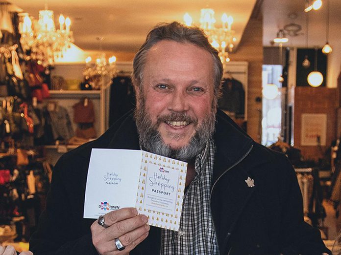 Terry Guiel, executive director of the Peterborough Downtown Business Improvement Area, shows off a Holiday Shopping Passport during the launch of the 2019 program, which encouraged shoppers to spend more than $2.3 million at local businesses in downtown Peterborough. (Photo courtesy of Peterborough DBIA)