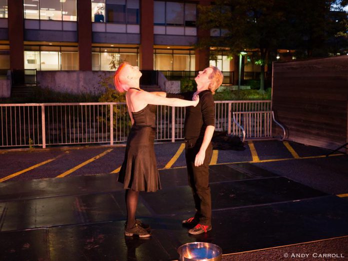 Kate Story and Ryan Kerr perform "Love in the Time of Covid" in the parking lot behind The Theatre On King in downtown Peterborough in early October 2020. The small not-for-profit black-box theatre, which has been closed since the pandemic began, is raising funds to make it through the pandemic with the support of local businesses along with Public Energy Performing Arts. (Photo: Andy Carroll)