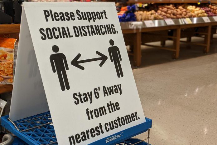 Physical distancing signs at Morello's Independent Grocer in Peterborough. (Photo: Bruce Head / kawarthaNOW.com)