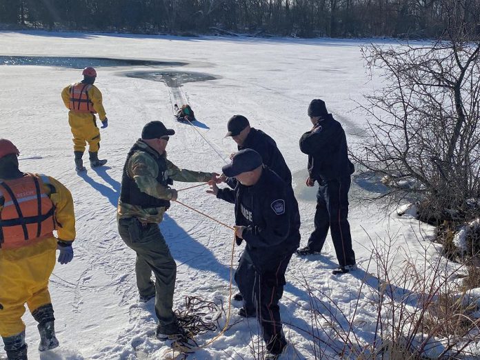 Members of the Kawartha Lakes Police Service and Kawartha Lakes Fire and Rescue rescue a woman who had fallen through thin ice on Scugog River in Lindsay on December 29, 2020. (Photo courtesy of Kawartha Lakes Police Service)