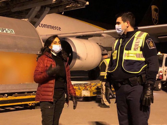 Oakville MP Anita Anand welcoming the first 30,000 doses of the Pfizer-BioNTech COVID-19 vaccine to Canada on December 13, 2020. Peterborough-Kawartha MP Maryam Monsef says the arrival of the vaccine marks the beginning of Canada's path to recovery. (Photo: Maryam Monsef / Facebook)