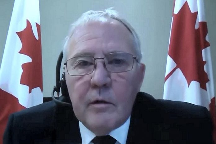 Canada's public safety and emergency preparedness minister Bill Blair speaking virtually at a media conference on December 30, 2020, when the federal government announced all air travellers entering Canada must prove they have had a negative PCR COVID-19 test within 72 hours before arriving in the country. (CPAC screenshot)