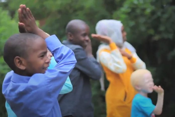 This past summer, a newcomer family sings the viral children's hit song "Baby Shark", a favourite among newcomer children as it helps them learn language while bringing them joy. Despite the pandemic, the New Canadians Centre has continued to offer programs for newcomers and refugees to keep them connected and to develop language and skills for success. But the non-profit charity needs your support to continue to to bring joy to newcomers and their families through these uncertain times. (Photo courtesy of the New Canadians Centre)