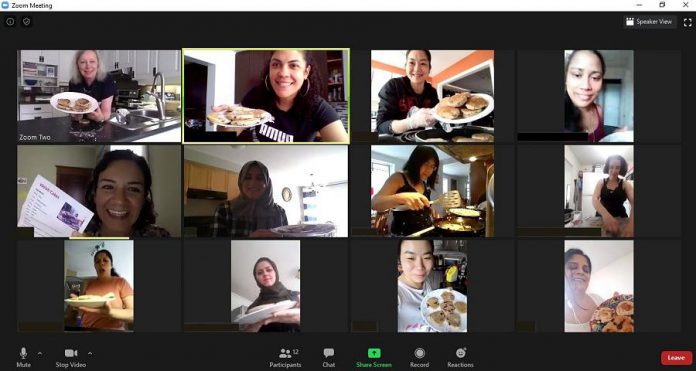 During the pandemic, New Canadians Centre staff delivered kits to newcomer women in the centre's long-standing women's group so the women could continue to meet weekly online and bond over crafts and baking.  Here, the women's group meets over Zoom to bake Welsh Cakes together. (Photo courtesy of the New Canadians Centre)