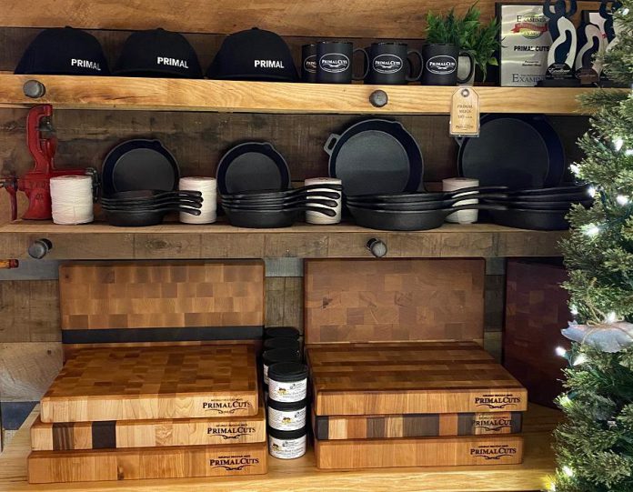 Along with meat, seafood, and prepared food, Primal Cuts offers branded clothing and accessories, cutting boards, Charcuterie boards, grilling planks, and more. (Photo courtesy of Primal Cuts)