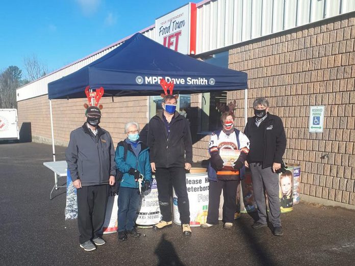 North Kawartha mayor Carolyn Amyotte (second from right) with Peterborough-Kawartha MPP Dave Smith (middle) during a food drive at Sayers Foods on November 28, 2020, which raised more than $21,000 worth of food for North Kawartha Food Bank, located right across the street. Some Apsley residents may be relying on the food bank in the short term now that fire has destroyed Sayers Foods, the only grocery store in the Apsley area. (Photo: Dave Smith / Facebook)