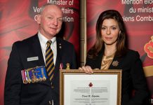 David Edgerton receiving the federal Minister of Veterans Affairs Commendation from Parliamentary Secretary Eve Adams in 2012. (Photo: Veteran Affairs Canada)