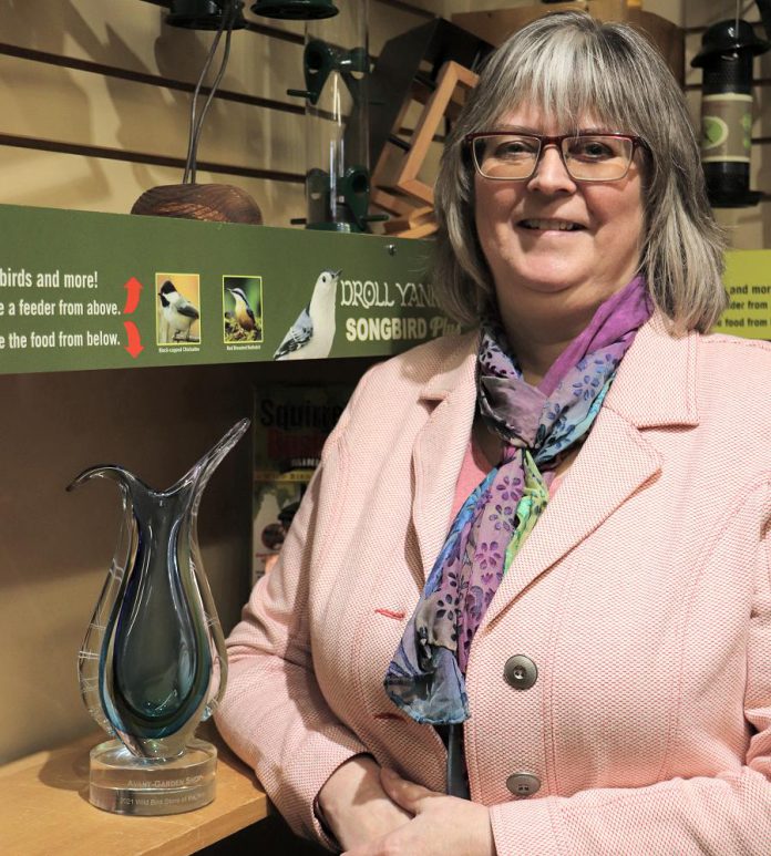 Brenda Ibey, owner of The Avant-Garden Shop in downtown Peterborough, with her 2021 Wild Bird Store of the Year from Newmarket-based Wild Bird Trading, the leading supplier to the wild bird industry across Canada. (Supplied photo)