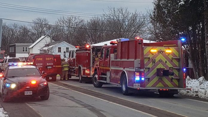 Northumberland OPP and Cramahe Township Fire Department vehicles responding to a house fire in the town of Colborne on January 6, 2021, which claimed the life of a 45-year-old woman. (Photo; OPP)