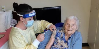 Elizabeth Campbell, a 106-year-old resident at Fairhaven long-term care home in Peterborough, was the first person in the Peterborough area to receive a COVID-19 vaccine. The Moderna vaccine was administered on January 26, 2021 by Lori Rowsell, infection prevention and control practitioner at Fairhaven. (Photo: Peterborough Public Health)