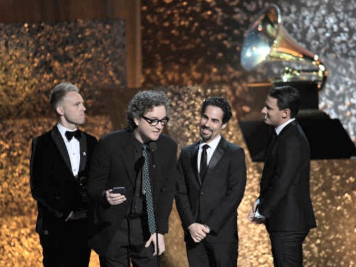 Greg Wells (second from left) won a Grammy Award in 2019 for his production work on the soundtrack to the film "The Greatest Showman", the best-selling album globally in 2018. (Screenshot via gregwells.net)