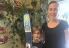 Carlotta James of Peterborough Pollinators with her 7-year-old son Salvador Haines, who painted this canoe paddle for the Painted Paddle art exhibit, which features 20 canoe paddles painted by volunteer artists on display at various locations in downtown Peterborough throughout February. Salvador says his paddle art, called The Elements, "represents the balance in nature with flowers blooming during the day and its roots growing by night, surrounded by the four elements: light blue for air, dark blue for water, red for fire and green for earth. Also, there’s a secret word painted in the roots, can you find it?". (Photo: Peterborough Pollinators / Facebook)