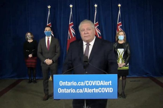 A sombre Ontario Premier Doug Ford arrives at a media conference on Queen's Park on January 8, 2021, accompanied by Ontario's associate chief medical officer of health Dr. Barbara Yaffe, education minister Stephen Lecce, and health minister Christine Elliott. (CPAC screenshot)