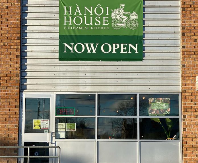 A temporary banner made by Signarama Peterborough hangs at the new second location of Hanoi House at Lansdowne Street West in Peterborough. (Photo courtesy of Hanoi House)