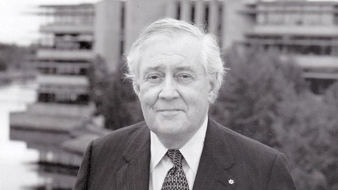 Thomas H.B. Symons in front of the Bata Library at Trent University in Peterborough. The founding president of the university, Professor Symons has passed away at the age of 91. (Photo courtesy of Trent University)