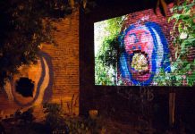 Peterborough-area artists can now apply for funding for Artsweek SHIFT2, a "pocket festival" of the arts running from March to May in advance of the full Artsweek festival scheduled for fall 2021. Pictured is "The Door That You Walk Through", a film by Daniel Crawford projected onto the side of an abandoned brick building behind The Only Café, during Artsweek 2018. (Photo: Andy Carroll)
