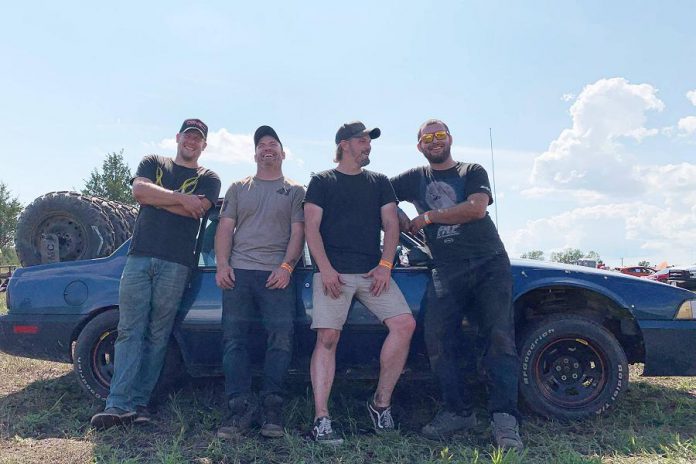 Jeremy Kelly (second from right) and Tyler Junkin, Nate Mitchell, and Andy McCann with kawarthaNOW writer Paul Rellinger's former 1988 Chevrolet Cavalier. (Photo courtesy of Ellisha Tryon)