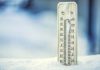 Thermometer on snow showing extreme cold temperature of more than -30C. (Stock photo)