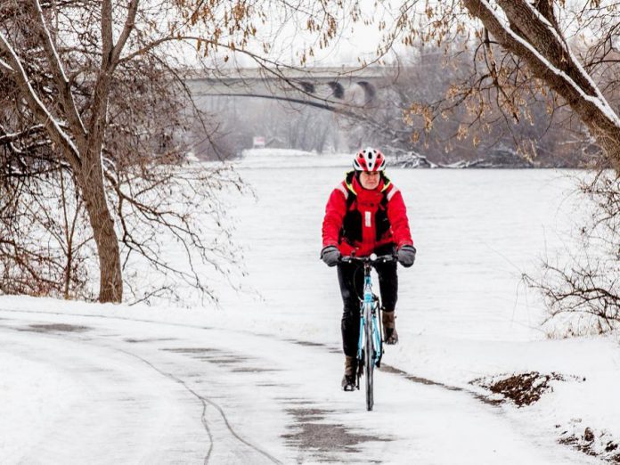 Peterborough is home to many year-round cyclists. For some it is a way to get outside, for others a main mode of travel. Here, Peterborough resident Carol Love rides her bike along the Millennium Trail. (Photo: Vicky Paradisis)