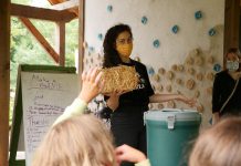 Jen Feigin, executive director of the Endeavour Centre, speaks about sustainable building approaches during the 2020 pilot of GreenUP's Girls Climate Leadership Camp at Peterborough's Ecology Park. The camp gave a small cohort of girls the opportunity to learn about the impacts of climate change, to develop strategies to support action in their households, and to meet inspiring women-identified climate leaders who are creating positive change in our community. (Photo: Ben Hargreaves)