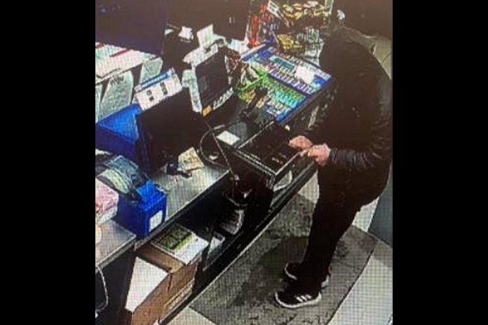 Police are seeking this man who robbed a William Street North business in Lindsay on February 22, 2021. (Police-supplied photo)