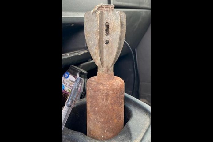 A person who found this old munition during renovations took it to the Brighton OPP Detachment. Police are cautioning people not to touch or transport any military ordnance or explosive devices they may find but to contact police. (OPP / Facebook)