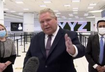 Ontario premier Doug Ford, after visiting a COVID-19 testing facility for arriving passengers at Toronto Pearson International Airport, commented that an announcement is expected on February 8, 2021 on the easing of public health restrictions in the province, except in "hot zones". (CPAC screenshot)