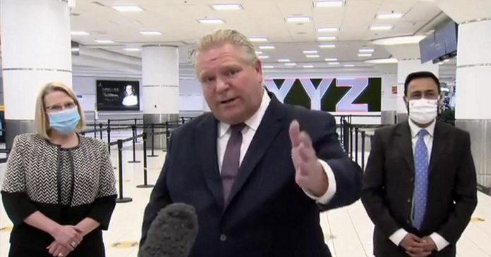 Ontario premier Doug Ford, after visiting a COVID-19 testing facility for arriving passengers at Toronto Pearson International Airport, commented that an announcement is expected on February 8, 2021 on the easing of public health restrictions in the province, except in "hot zones". (CPAC screenshot)