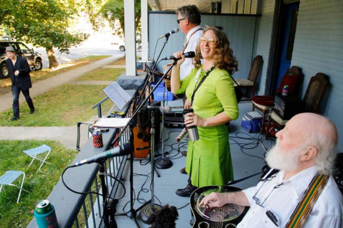 One of organizer Ken Tuck's ideas for a post-pandemic celebration in Peterborough is having musicians perform on the streets. From 2015 to 2018, Artsweek Peterborough hosted "Porchapoloza", where local musicians played from the porches of homes in different Peterborough neighbourhoods. Pictured are Hank and Kristine Fisher performing during the first Porchapoloza in 2015. (Photo: Artsweek Peterborough)