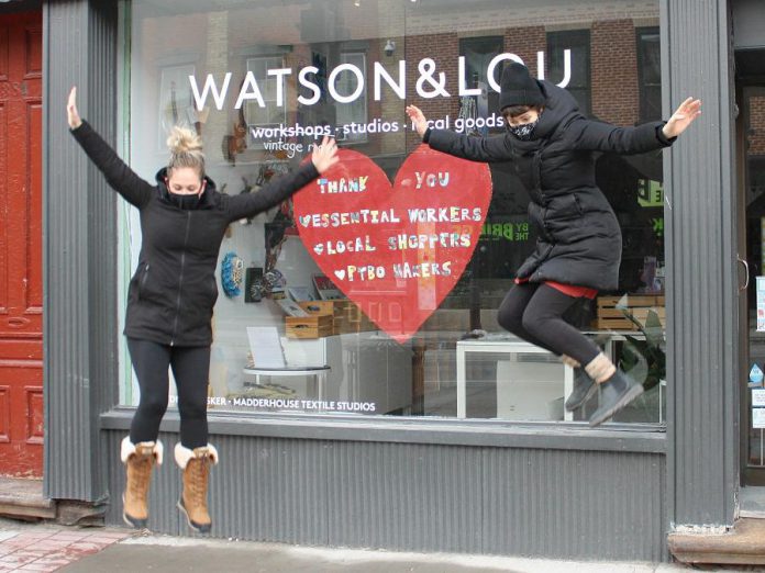 Watson & Lou co-owners Erin Watson and Anna Eidt literally jump for joy after recently reopening the doors of their downtown Peterborough shop to in-person shoppers. Their creative hub, which helps local artists and makers reach a wider audience year-round, continues to also offer online shopping, curbside pickup, and free local delivery. (Photo courtesy of Watson & Lou)