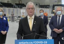 Cobourg mayor John Henderson at a media conference with Ontario Premier Doug Ford when the COVID-19 mass immunization at Cobourg Community Centre opened on March 15, 2021. (CPAC screenshot)