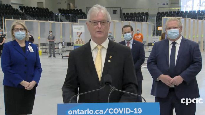 Cobourg mayor John Henderson at a media conference with Ontario Premier Doug Ford when the COVID-19 mass immunization at Cobourg Community Centre opened on March 15, 2021. (CPAC screenshot)